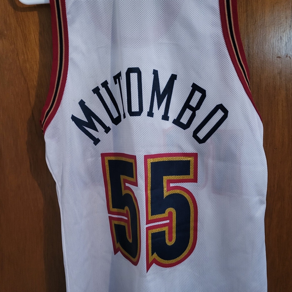 Champion White Jersey with Red and Gold Details. Mutombo.